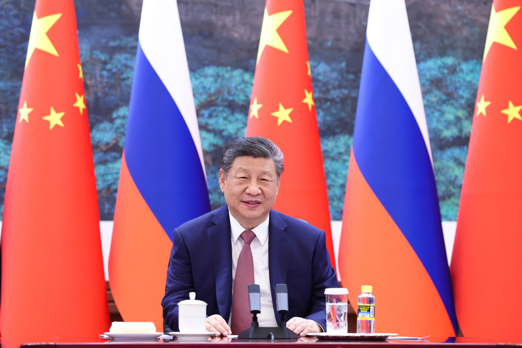 In this photo released by Xinhua News Agency, Chinese President Xi Jinping holds a virtual meeting with Russian President Vladimir Putin, unseen, at the Great Hall of the People in Beijing on Wednesday, Feb. 4, 2026. (Huang Jingwen/Xinhua via AP)