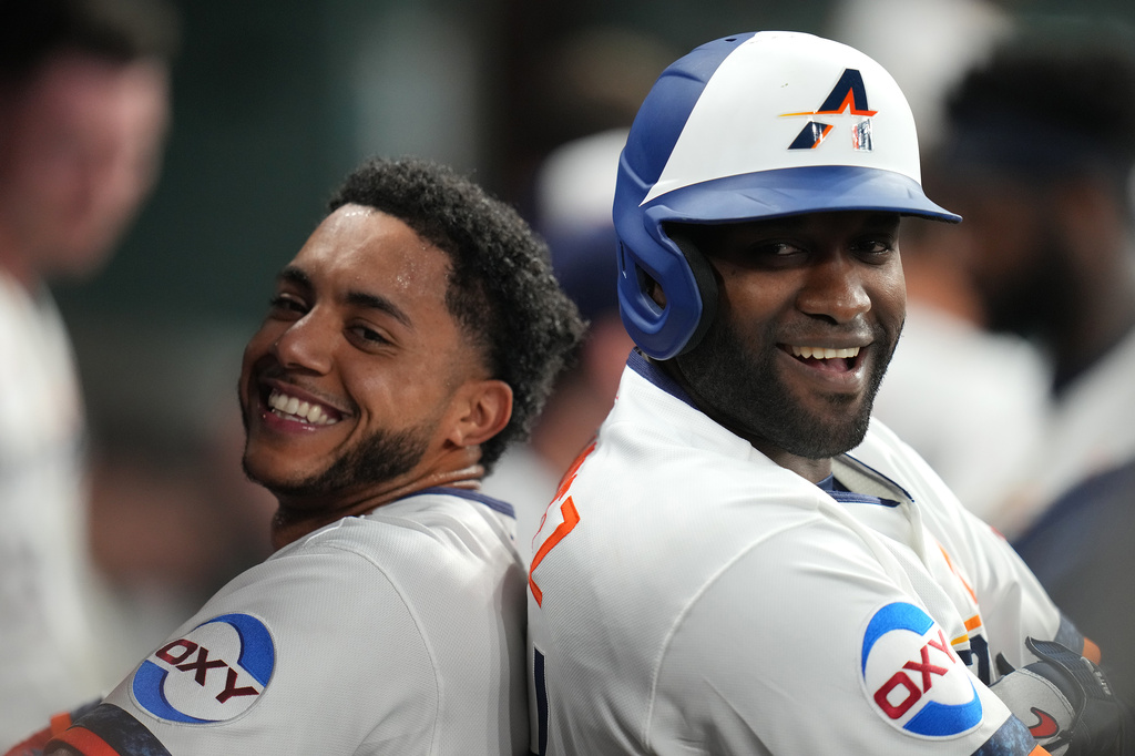 Houston Astros' Jeremy Pena, left, and Yordan Alvarez, right, celebrate after their back-to-back home runs off Miami Marlins starting pitcher Janson Junk during the second inning of a baseball game, Monday, July 20, 2026, in Houston. (AP Photo/Karen Warren)