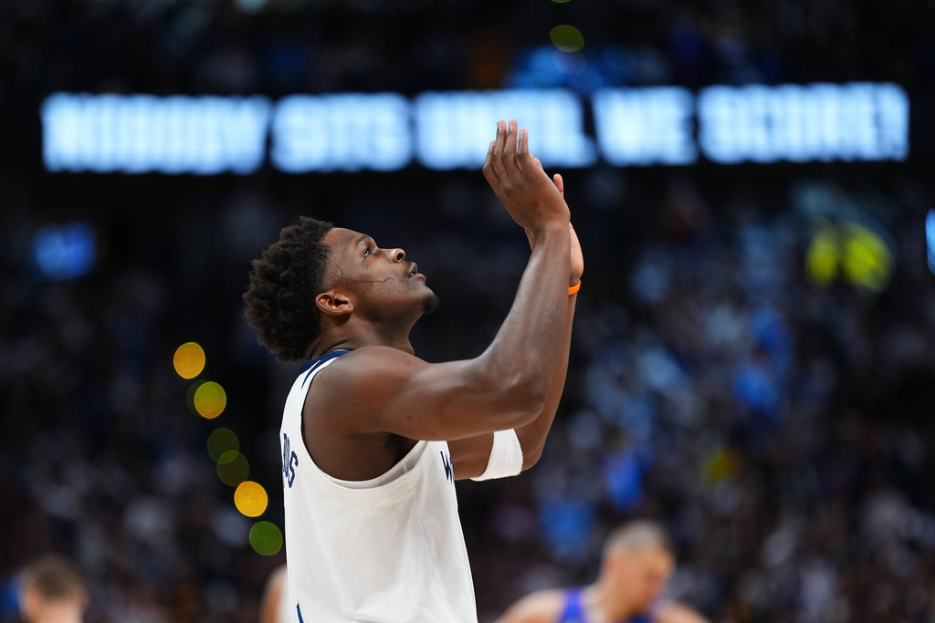 Minnesota Timberwolves guard Anthony Edwards gestures before the tipoff in Game 2 of a first-round NBA playoffs basketball series against the Denver Nuggets, Monday, April 20, 2026, in Denver. (AP Photo/Jack Dempsey)