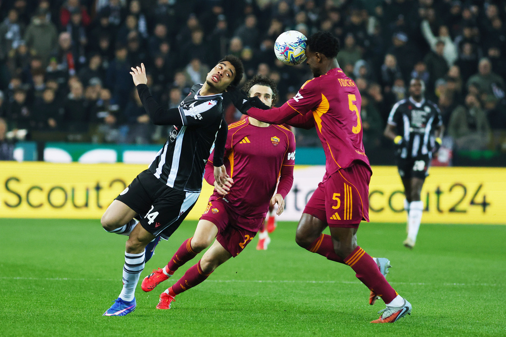Udinese's Arthur Atta, left, fights for the ball with Roma's Evan Ndicka during the Serie A soccer match between Udinese and Roma at the Bluenergy Stadium in Udine, Italy, Monday, Feb. 2, 2026. (Andrea Bressanutti/LaPresse via AP)