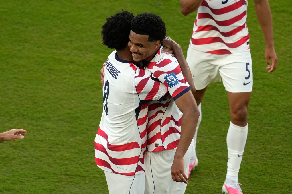 United States' Malik Tillman (17) celebrates with Weston McKennie (8)after scoring his side's second goal during the World Cup round of 32 soccer match between the United States and Bosnia in Santa Clara, Calif., near San Francisco, Wednesday, July 1, 2026. (AP Photo/Jeff Chiu)