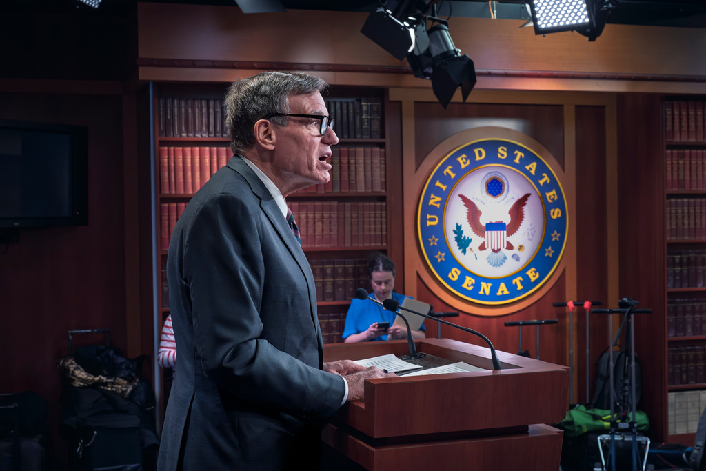 Sen. Mark Warner, D-Va., the vice chair of the Senate Intelligence Committee, speaks out against President Donald Trump's investigation of the 2020 presidential election ballots in Georgia, and the involvement of Trump ally Tulsi Gabbard, director of National Intelligence, during a news conference at the Capitol in Washington, Tuesday, Feb. 3, 2026. (AP Photo/J. Scott Applewhite)