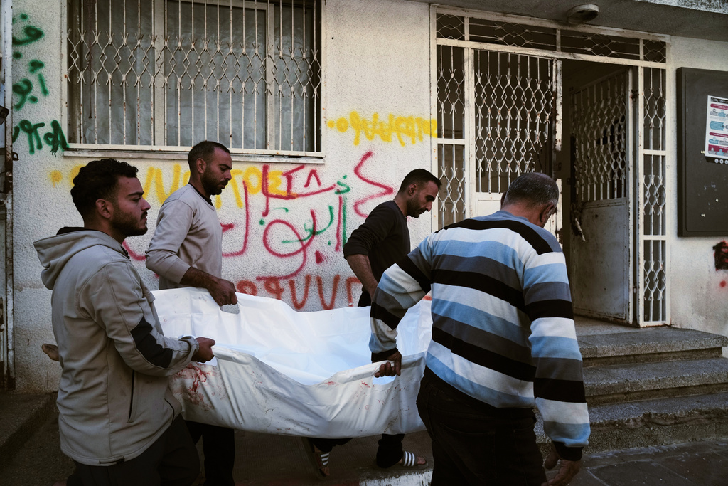 The body of 11-year-old Palestinian girl Hamsa Hosou, killed by Israeli fire in Jabalia, is brought to Shifa Hospital in Gaza City Thursday, Jan. 8, 2026. (AP Photo/Jehad Alshrafi)