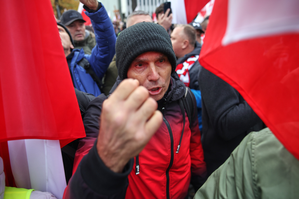 A man gestures during a protest in front of the Polish Constitutional Court in Warsaw, Poland, Saturday, Oct. 31, 2026. (AP Photo/Beata Zawrzel)