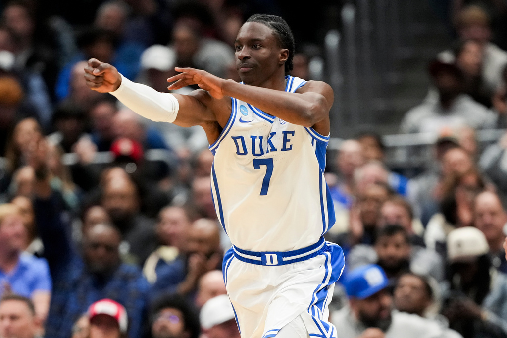 Duke guard Dame Sarr celebrates a basket against UConn during the first half in the Elite Eight of the NCAA college basketball tournament, Sunday, March 29, 2026, in Washington. (AP Photo/Stephanie Scarbrough)