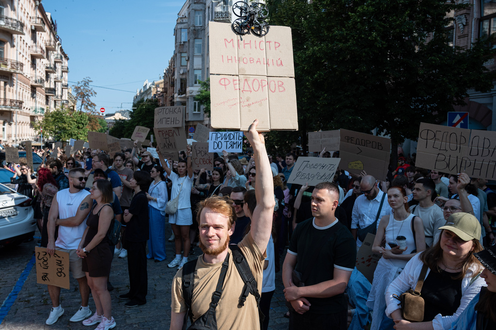 Ukrainians gather to denounce President Volodymyr Zelenskyy's decision to dismiss Defense Minister Mykhailo Fedorov after six months in the post, Kyiv, Ukraine, Thursday, July 16, 2026. Placard reads: Fedorov is a minister of innovation. (AP Photo/Danylo Antoniuk)