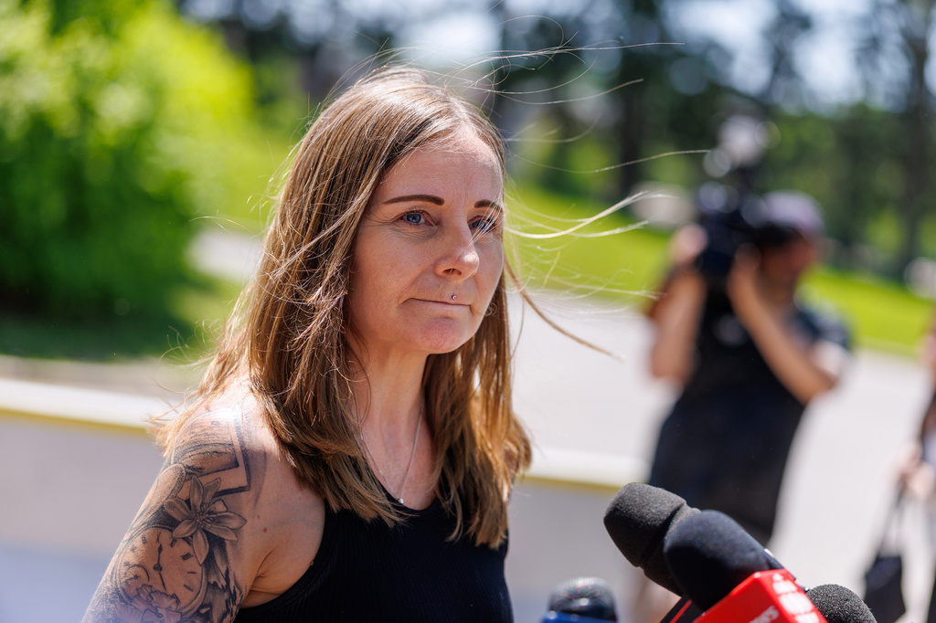 Kim Prosser speask to the media outside the Ontario Court of Justice, Friday, May 29, 2026, in Newmarket, Ontario, after Kenneth Law pleaded guilty to 14 counts of counseling or aiding suicide, including the death of Prosser's son Ashtyn. (Christopher Drost/The Canadian Press via AP)
