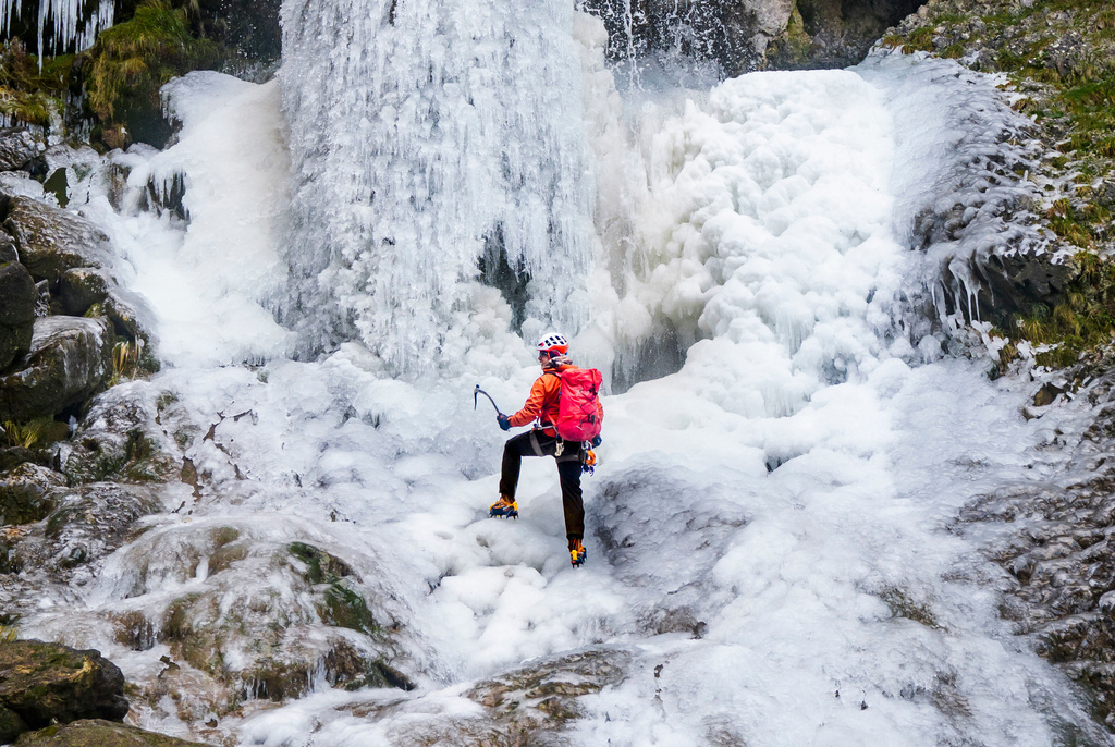 Lost Earth Adventures' instructor Mick Ellerton climbs a frozen waterfall in Gordale Scar near Malham Cove in the Yorkshire Dales National Park, as ice warnings are in place across the UK ahead of a storm which is set to bring heavy snow later in the week, on Wednesday Jan. 7, 2026. (Danny Lawson/PA via AP)