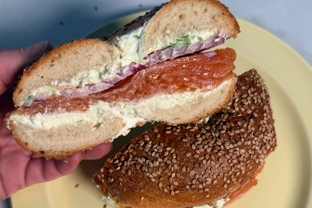 A bagel with smoked salmon, scallion cream cheese, and red onion, from Tal Bagels appears in New York on Sept. 13, 2026. (Katie Workman via AP)