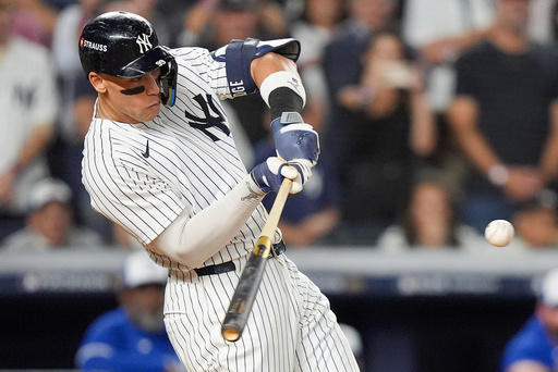 New York Yankees' Aaron Judge connects for a three-run home run against the Toronto Blue Jays during the fourth inning of Game 3 of baseball's American League Division Series, Tuesday, Oct. 7, 2025, in New York. (AP Photo/Frank Franklin II) New York Yankees' Aaron Judge connects for a three-run home run against the Toronto Blue Jays during the fourth inning of Game 3 of baseball's American League Division Series, Tuesday, Oct. 7, 2025, in New York. (AP Photo/Frank Franklin II)