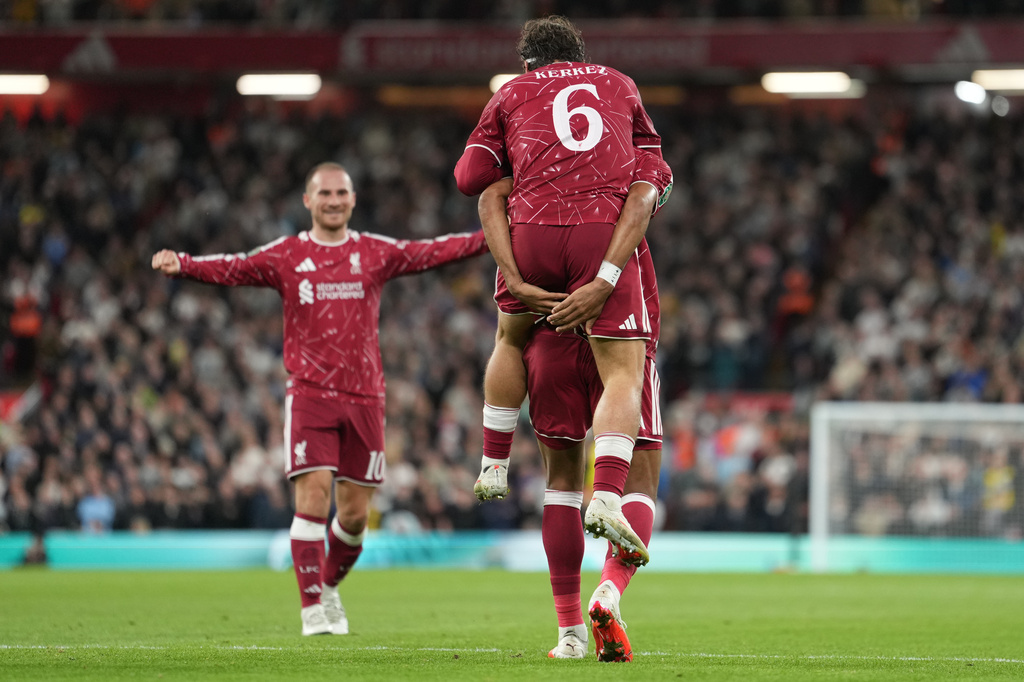 Liverpool players celebrate after a goal during the third-round English Football League soccer match between Liverpool and Tottenham in Liverpool, England, Tuesday Sept. 15, 2026. (AP Photo/Jon Super)