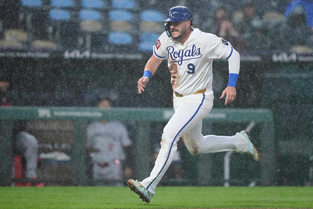 Kansas City Royals' Vinnie Pasquantino runs home to score on a single by Jonathan India during the third inning of a baseball game against the Minnesota Twins, Wednesday, April 1, 2026, in Kansas City, Mo. (AP Photo/Charlie Riedel)