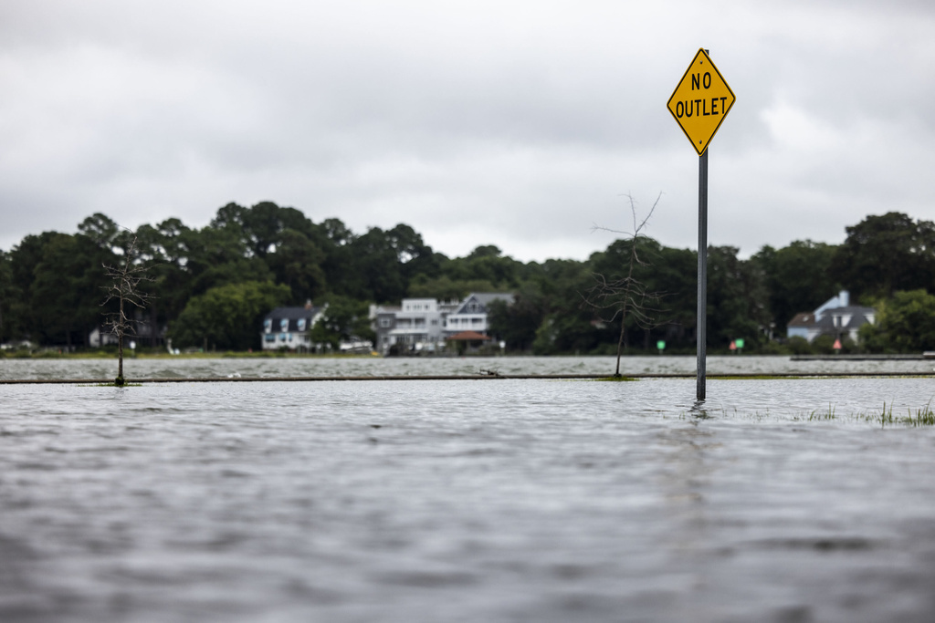 The areas lining the Lafayette River in Colonial Place neighborhood of Norfolk, Va., flood as a result of Hurricane Erin, Thursday, Aug. 21, 2025. (Kendall Warner/The Virginian-Pilot via AP)
