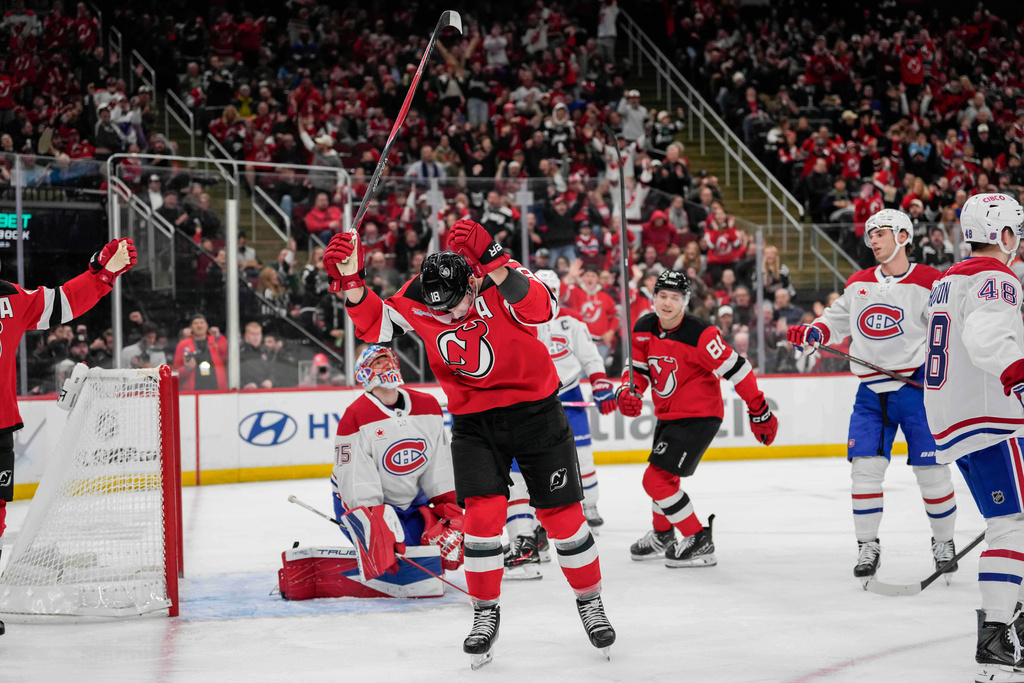 New Jersey Devils left wing Ondrej Palat (18) celebrates after scoring during the second period of an NHL hockey game against Montreal Canadiens, Thursday, Nov. 6, 2025, in Newark, N.J. (AP Photo/Yuki Iwamura)