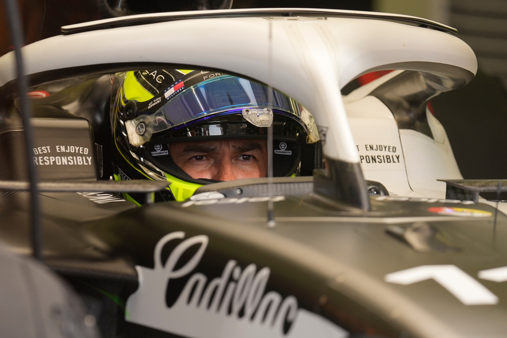 Cadillac driver Sergio Perez of Mexico waits in his car during a Formula One pre-season test at the Bahrain International Circuit in Sakhir, Bahrain, Wednesday, Feb. 11, 2026. (AP Photo/Altaf Qadri)