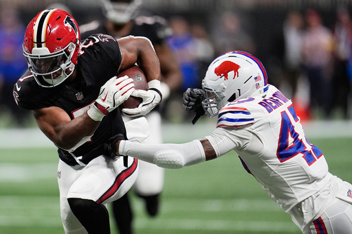 Atlanta Falcons running back Bijan Robinson (7) runs past Buffalo Bills cornerback Christian Benford (47) during the first half of an NFL football game, Monday, Oct. 13, 2025, in Atlanta. (AP Photo/Mike Stewart) Atlanta Falcons running back Bijan Robinson (7) runs past Buffalo Bills cornerback Christian Benford (47) during the first half of an NFL football game, Monday, Oct. 13, 2025, in Atlanta. (AP Photo/Mike Stewart)