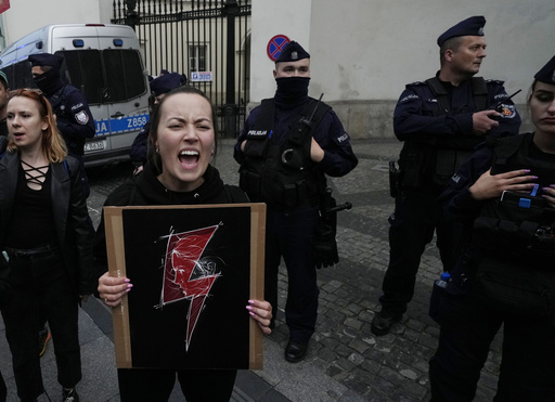 FILE - People protest Poland's restrictive abortion law in Warsaw, Poland, on June 14, 2023. A long-awaited parliamentary debate on liberalizing Poland's strict abortion law is scheduled to begin Thursday, March 11, 2024. The traditionally Catholic nation has one of the most restrictive laws in Europe &mdash; but the reality is that many women terminate pregnancies at home with pills sent from abroad. (AP Photo/Czarek Sokolowski, File)