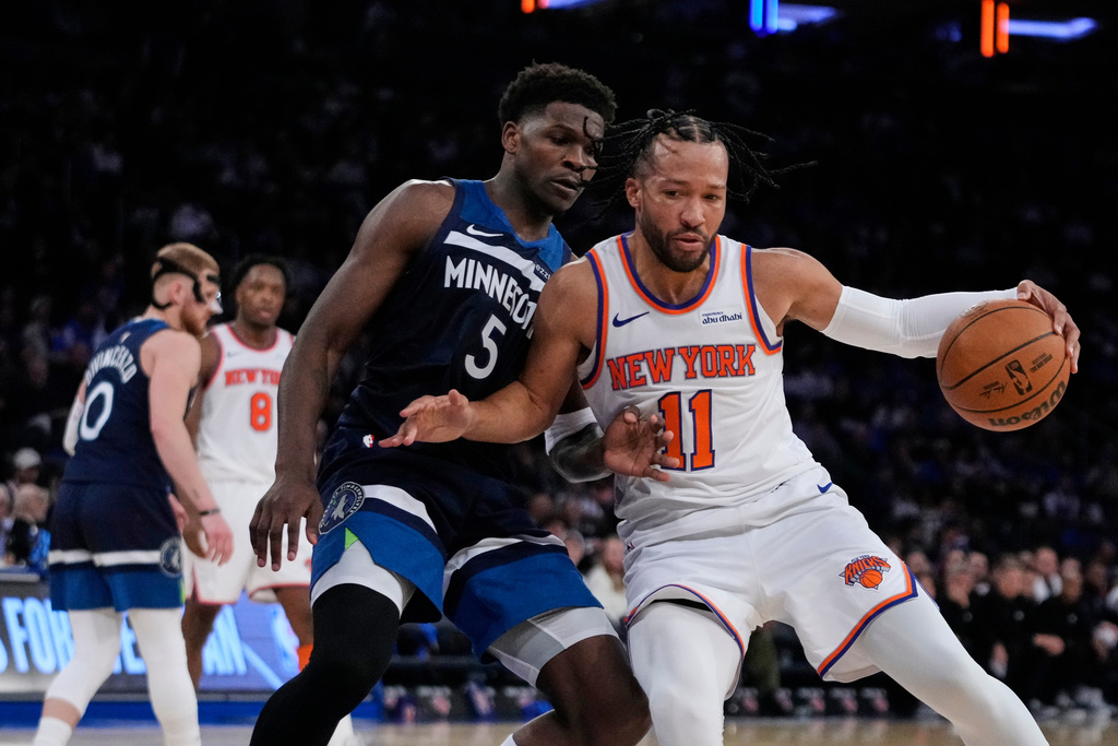 Minnesota Timberwolves' Anthony Edwards (5) defends New York Knicks' Jalen Brunson (11) during the second half of an NBA basketball game Wednesday, Nov. 5, 2025, at Madison Square Garden in New York. (AP Photo/Frank Franklin II)