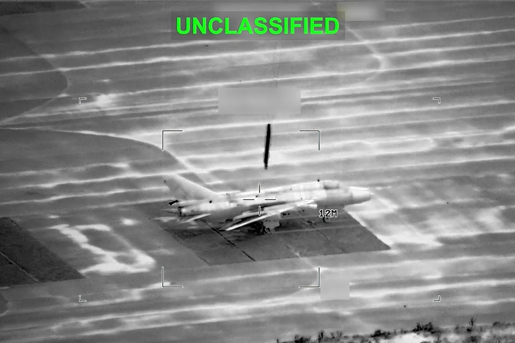 This partially redacted image from video provided by U.S. Central Command shows a military aircraft in Iran shortly before it was struck by a missile fired by U.S. forces on Sunday, March 1, 2026. (U.S. Central Command via AP)