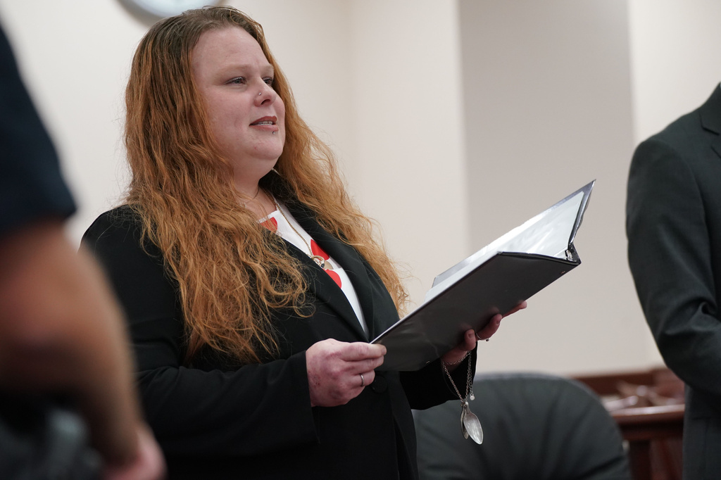 FILE - Lisa Meindl Payne, whose mother Deborah Meindl was murdered in 1993, reads a statement to the court asking for the dismissal of charges against James Pugh, who served more than 30 years in prison for the crime before his conviction was overturned, in the case for retrial of Pugh, Dec. 2, 2025 in Buffalo, N.Y. (Derek Gee /The Buffalo News via AP, File)