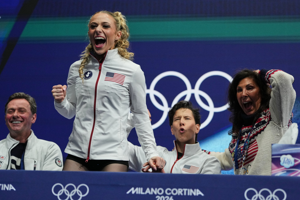 Emilea Zingas and Vadym Kolesnik of the United States react to their scores after competing during the rhythm dance in figure skating at the 2026 Winter Olympics, in Milan, Italy, Monday, Feb. 9, 2026. (AP Photo/Natacha Pisarenko)