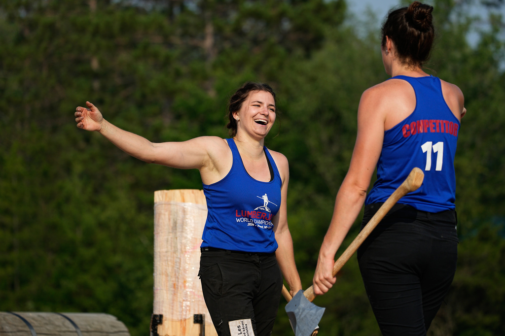 Karolina Urbanová, of the Czech Republic, and Stephanie Naud, of Canada, celebrate after Urbanovà broke the world record in the women's underhand chop event during the Lumberjack World Championships, Saturday, July 18, 2026, in Hayward, Wis. (AP Photo/Ellen Schmidt)