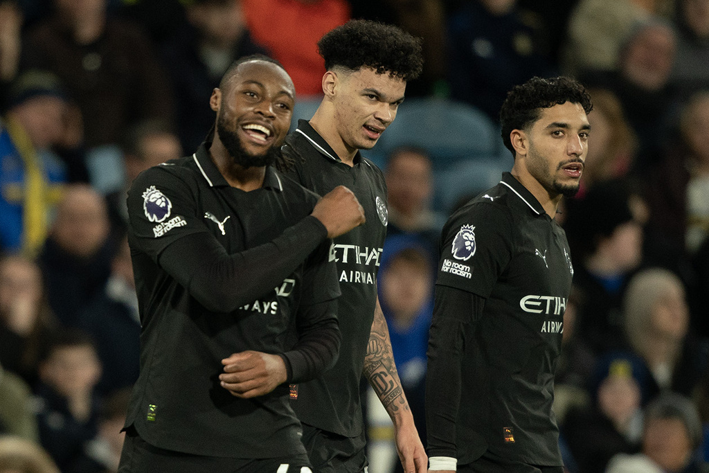 Manchester City's Antoine Semenyo, left, reacts after scoring during the Premier League soccer match between Leeds United and Manchester City in Leeds, England, Saturday, Feb. 28, 2026. (AP Photo/Ian Hodgson)