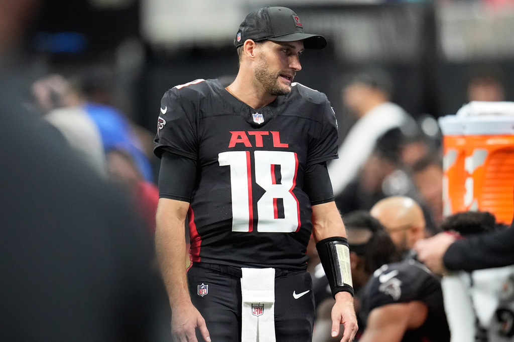 Atlanta Falcons quarterback Kirk Cousins (18) stands on the sideline during the second half of an NFL football game against the Miami Dolphins, Sunday, Oct. 26, 2025, in Atlanta. (AP Photo/Mike Stewart)