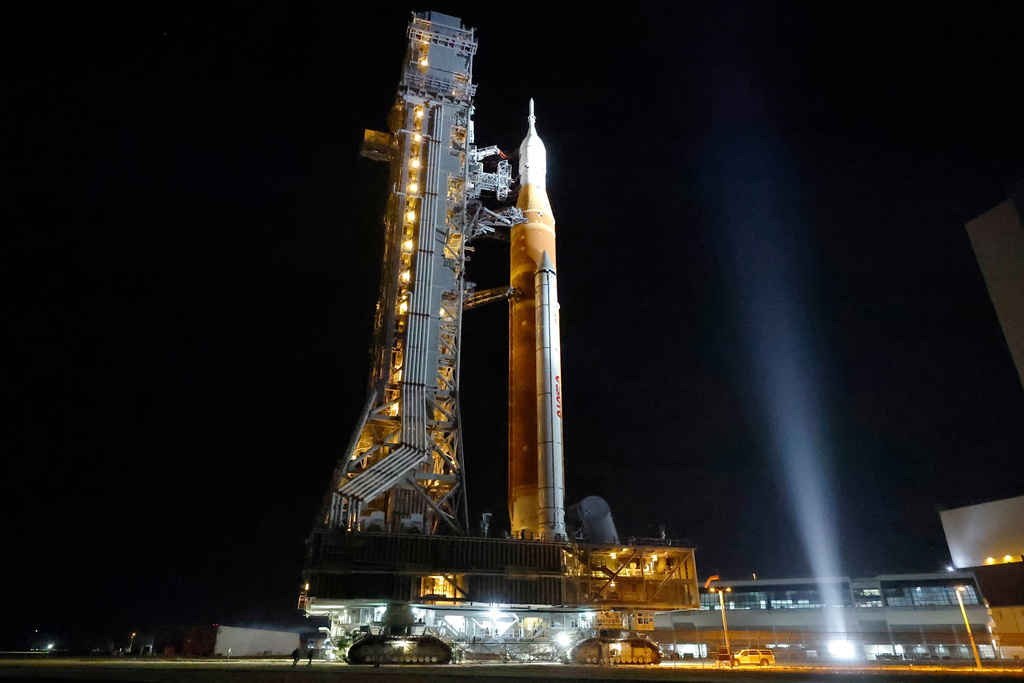 The NASA Artemis II rocket with the Orion spacecraft aboard leaves the Vehicle Assembly Building moving slowly to pad 39B at the Kennedy Space Center in Cape Canaveral, Fla., Friday, March 20, 2026. (AP Photo/Terry Renna)