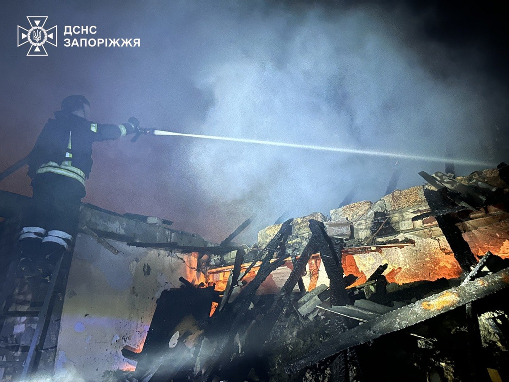 In this photo, provided by the Ukrainian Emergency Service, firefighters extinguish a fire in a residential building following a Russian drone attack in Zaporizhzhia, Ukraine, Friday, June 26, 2026. (Ukrainian Emergency Service via AP)