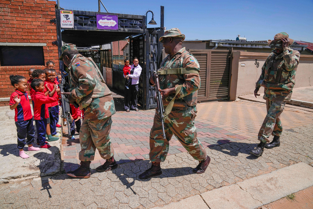 South African National Defense Forces deploy in the Riverlea township of Johannesburg, South Africa, Wednesday, March 11, 2026. (AP Photo/Themba Hadebe)
