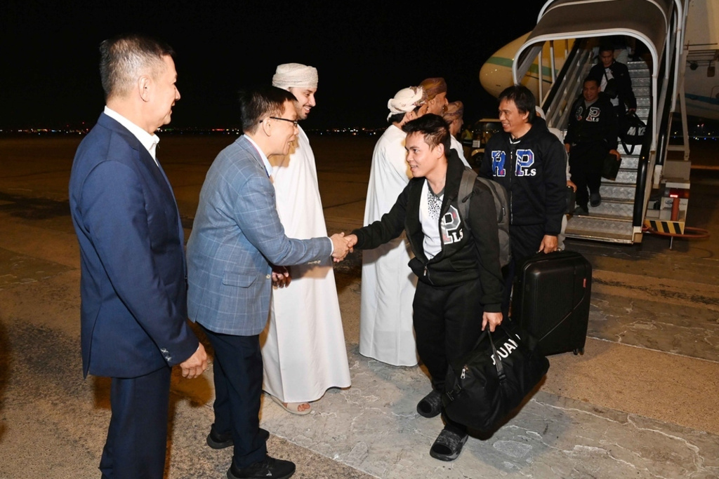 In this image released by Oman News Agency, mariners held for months by Yemen's Houthi rebels arrive in Muscat, Oman, Wednesday, Dec. 3, 2025. (Oman News Agency via AP)