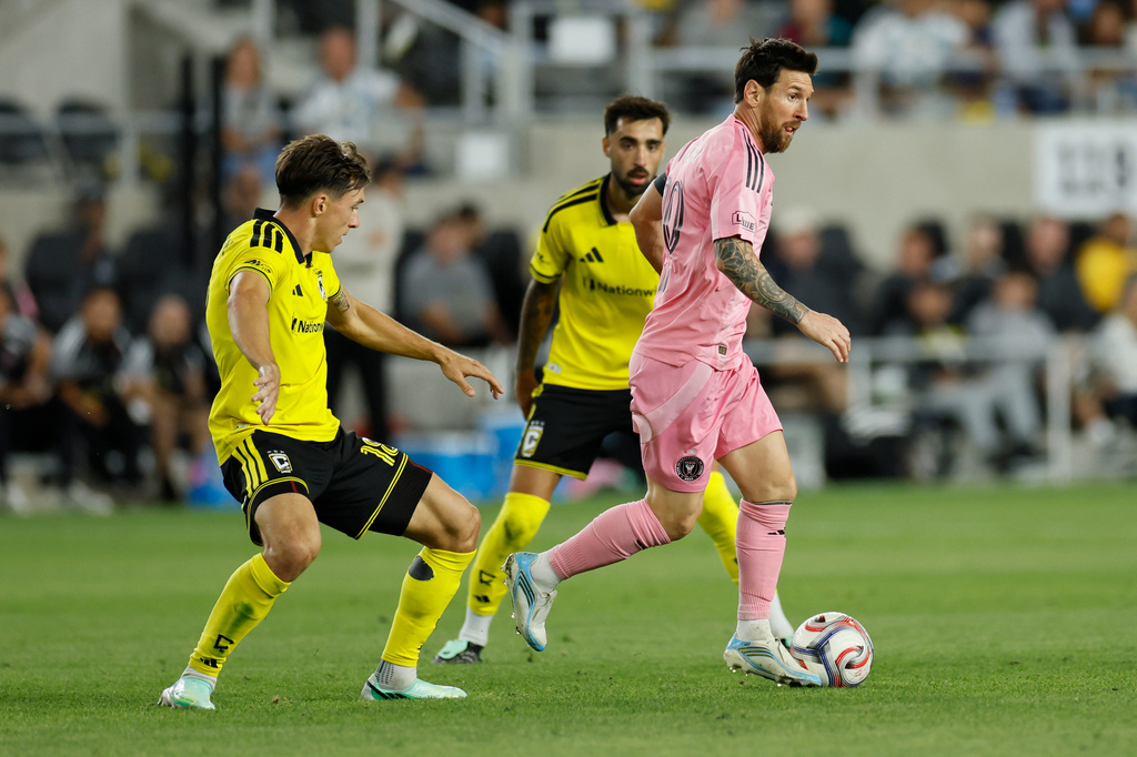 Inter Miami's Lionel Messi, right, kicks the ball past Columbus Crew's Malte Amundsen, left, during the first half of an MLS soccer match, Sunday, Sept. 27, 2026, in Columbus, Ohio. (AP Photo/Jay LaPrete)