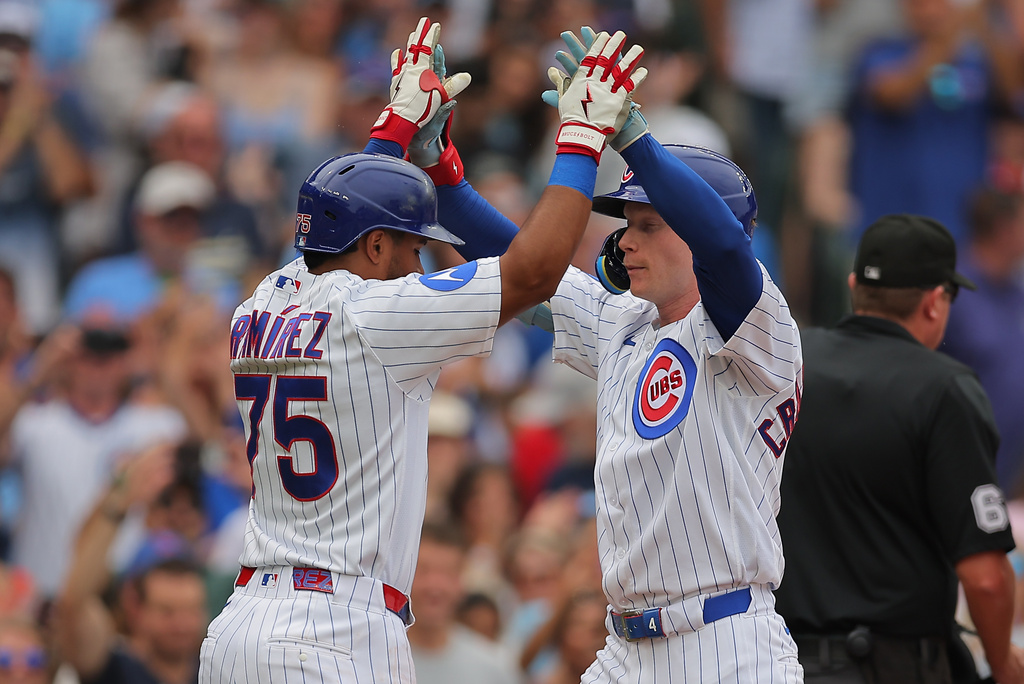 Chicago Cubs' Pete Crow-Armstrong, right, celebrates his two-run home run with teammate Pedro Ramírez, left, during the second inning of a baseball game against the Cincinnati Reds, Saturday, Aug. 29, 2026, in Chicago. (AP Photo/Melissa Tamez)