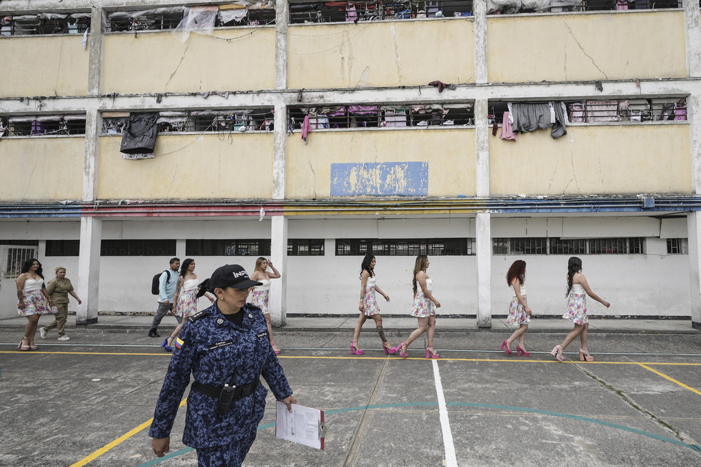 Inmates take part in the annual beauty pageant, held to mark the feast of the Virgin of Mercy, the patron saint of prisoners, at El Buen Pastor women's prison in Bogota, Colombia, Tuesday, Sept. 9, 2025. (AP Photo/Ivan Valencia)