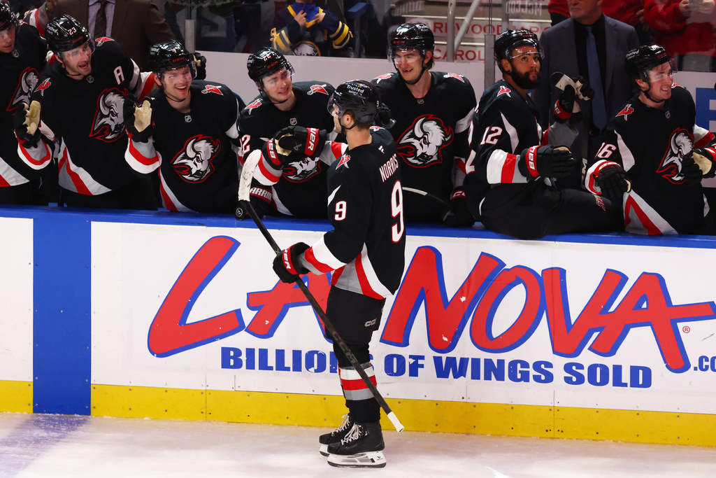 Buffalo Sabres center Josh Norris (9) celebrates after his goal during the third period of an NHL hockey game against the Philadelphia Flyers, Thursday, Dec. 18, 2025, in Buffalo, N.Y. (AP Photo/Jeffrey T. Barnes)