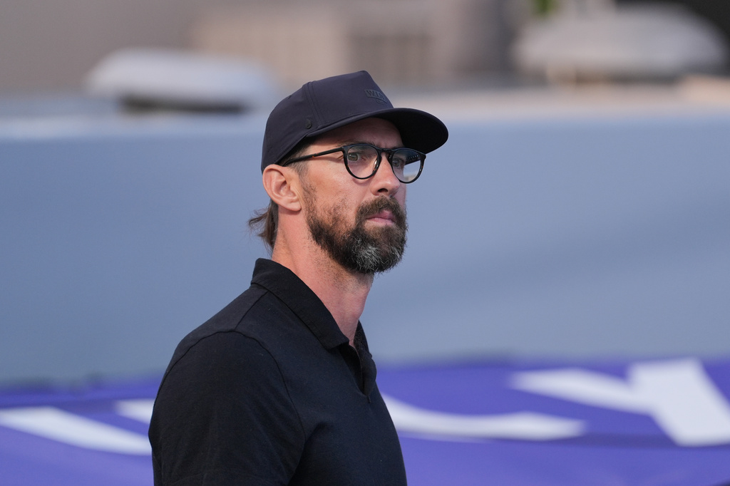 Michael Phelps attends the Pan Pacific Swimming Championships in Irvine, Calif., Wednesday, Aug. 12, 2026. (AP Photo/Jae C. Hong)