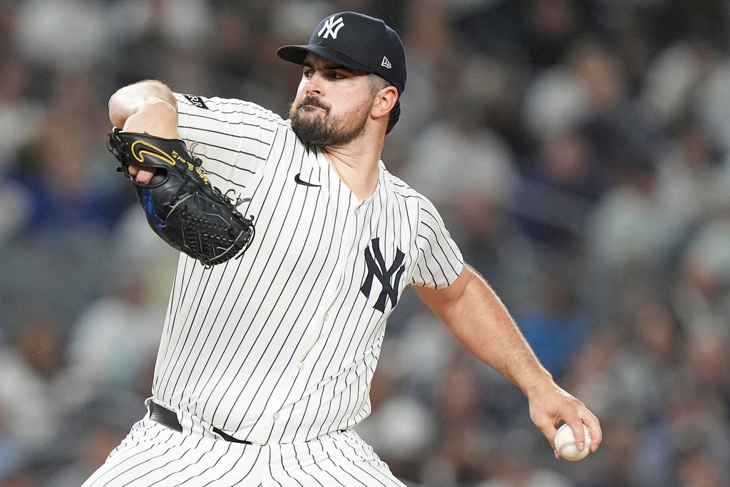 New York Yankees pitcher Carlos Rodón delivers against the Toronto Blue Jays during the first inning of Game 3 of baseball's American League Division Series, Tuesday, Oct. 7, 2025, in New York. (AP Photo/Frank Franklin II)