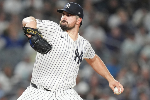 New York Yankees pitcher Carlos Rodón delivers against the Toronto Blue Jays during the first inning of Game 3 of baseball's American League Division Series, Tuesday, Oct. 7, 2025, in New York. (AP Photo/Frank Franklin II) New York Yankees pitcher Carlos Rodón delivers against the Toronto Blue Jays during the first inning of Game 3 of baseball's American League Division Series, Tuesday, Oct. 7, 2025, in New York. (AP Photo/Frank Franklin II)