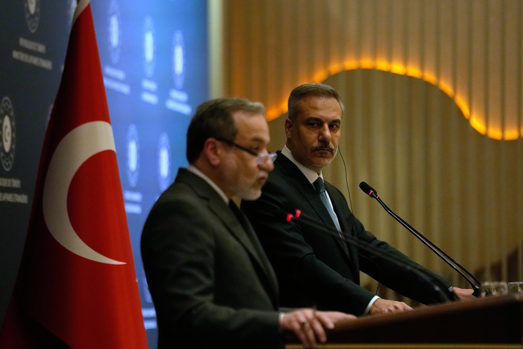 Turkish Foreign Minister Hakan Fidan, right, and his Iranian counterpart Abbas Araghchi hold a joint press conference in Istanbul, Turkey, Friday, Jan. 30, 2026. (AP Photo/Khalil Hamra)
