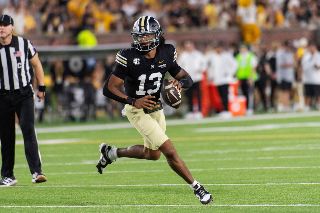 Missouri quarterback Austin Simmons looks to throw a pass during the first half of an NCAA college football game against Troy, Saturday, Sept. 19, 2026, in Columbia, Mo. (AP Photo/LG Patterson)