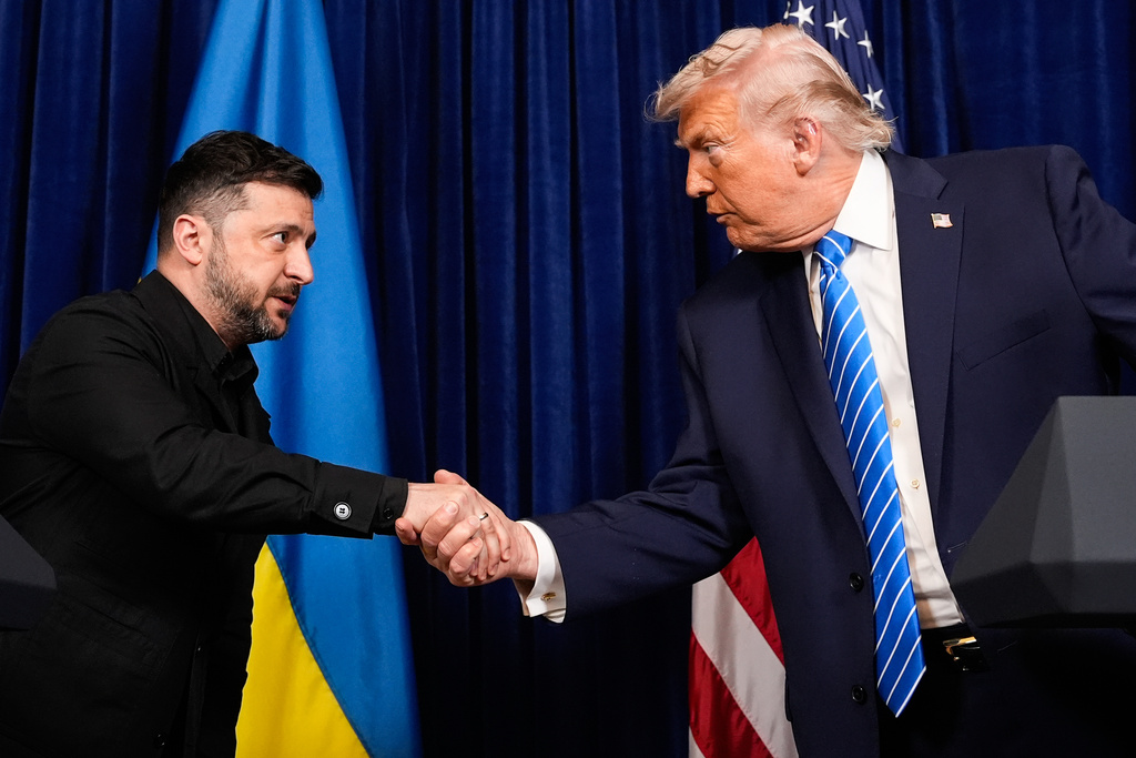 President Donald Trump and Ukraine's President Volodymyr Zelenskyy shake hands at the start of a joint news conference following a meeting at Trump's Mar-a-Lago club, Sunday, Dec. 28, 2025, in Palm Beach, Fla. (AP Photo/Alex Brandon)