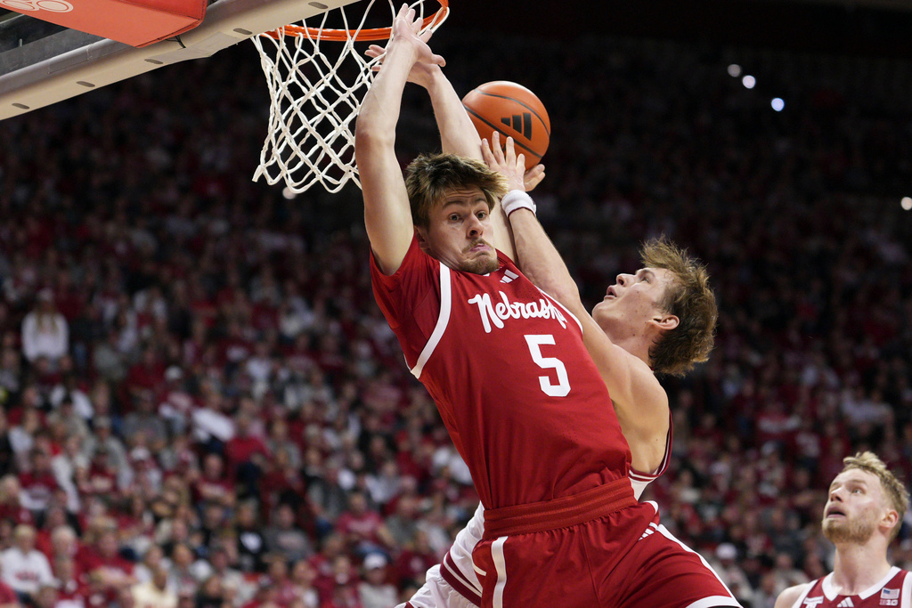 Indiana forward Reed Bailey, right behind, makes contact with Nebraska forward Braden Frager while shooting during the second half of an NCAA college basketball game in Bloomington, Ind., Saturday, Jan. 10, 2026. (AP Photo/AJ Mast)