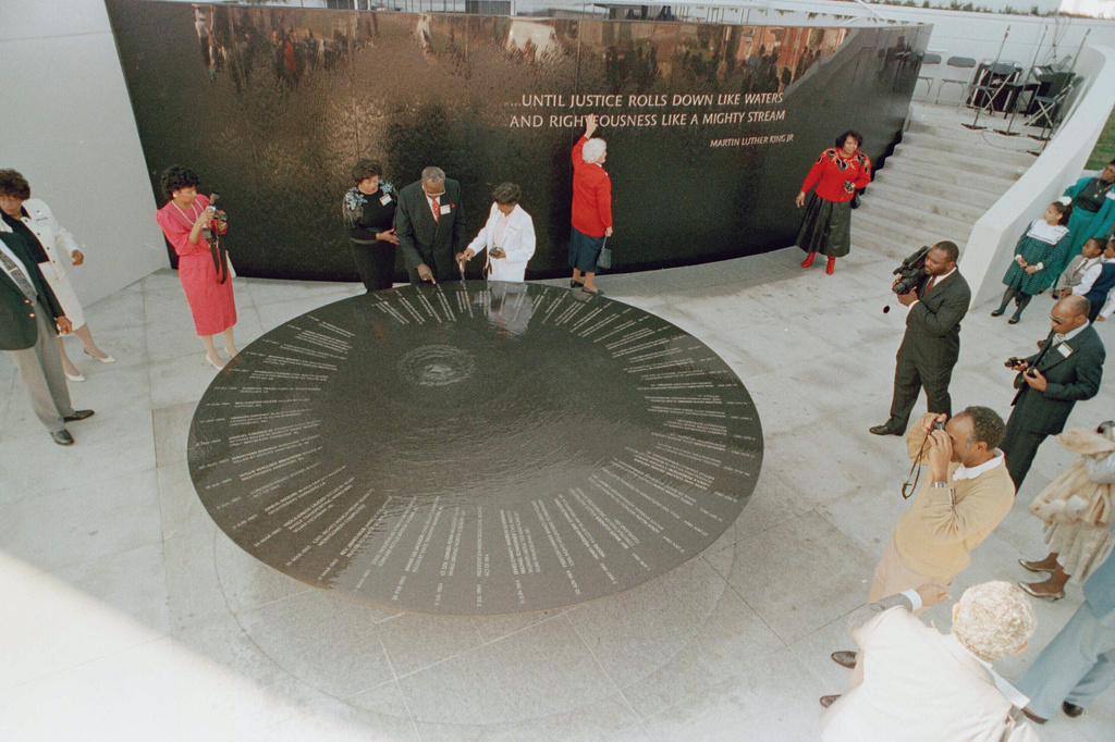 FILE - Family members of fallen civil rights activists view the Civil Rights Memorial at the Southern Poverty Law Center during a private family viewing, Nov. 5, 1989, in Montgomery, Ala. (AP Photo/Dave Martin, File)