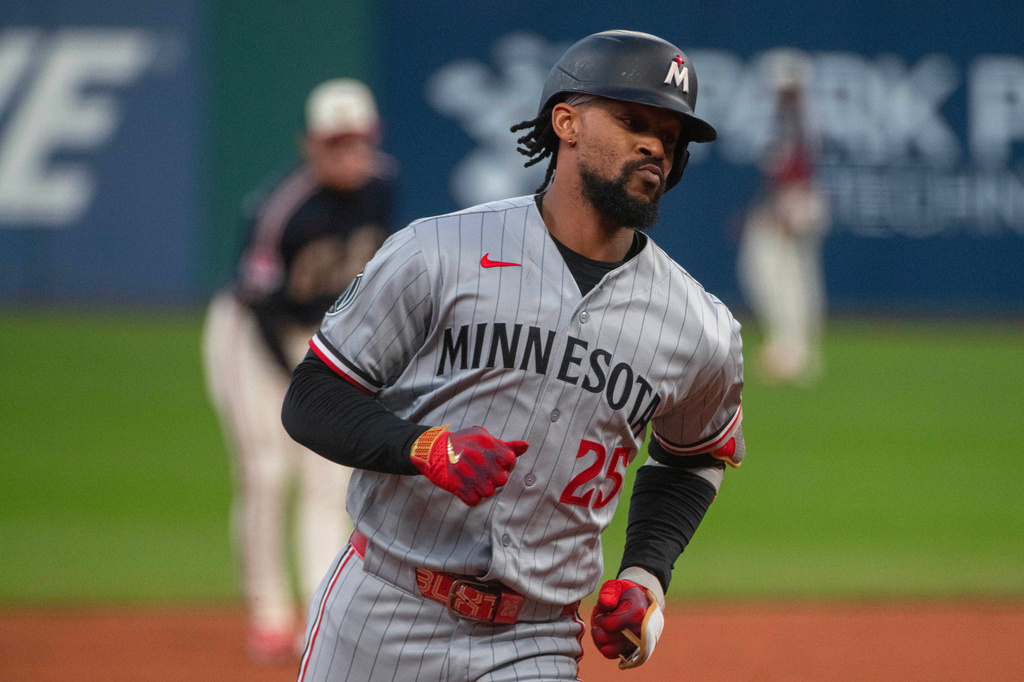 Minnesota Twins' Byron Buxton rounds the bases after hitting a solo home run off Cleveland Guardians starting pitcher Tanner Bibee during the first inning of a baseball game, Saturday, May 9, 2026, in Cleveland. (AP Photo/Phil Long)
