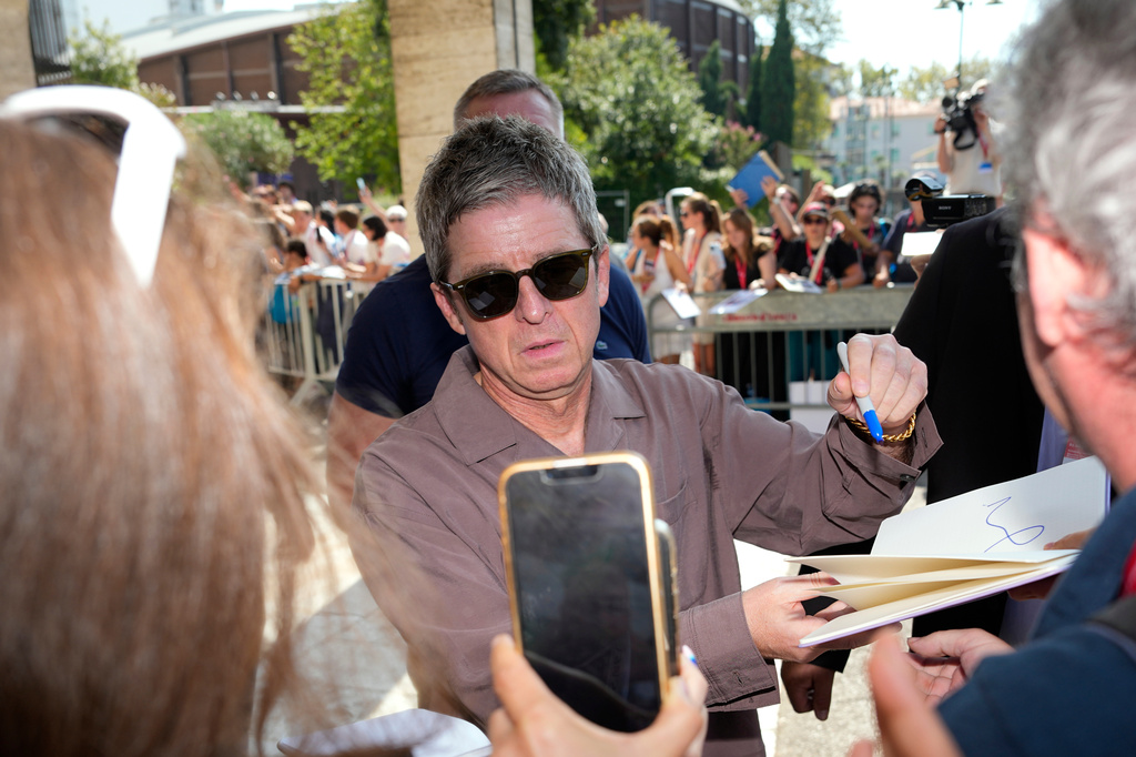 Noel Gallagher signs autographs upon departure from the 83rd edition of the Venice Film Festival in Venice, Italy, on Saturday, Sept. 5, 2026. (Photo by Alessandra Tarantino/Invision/AP)