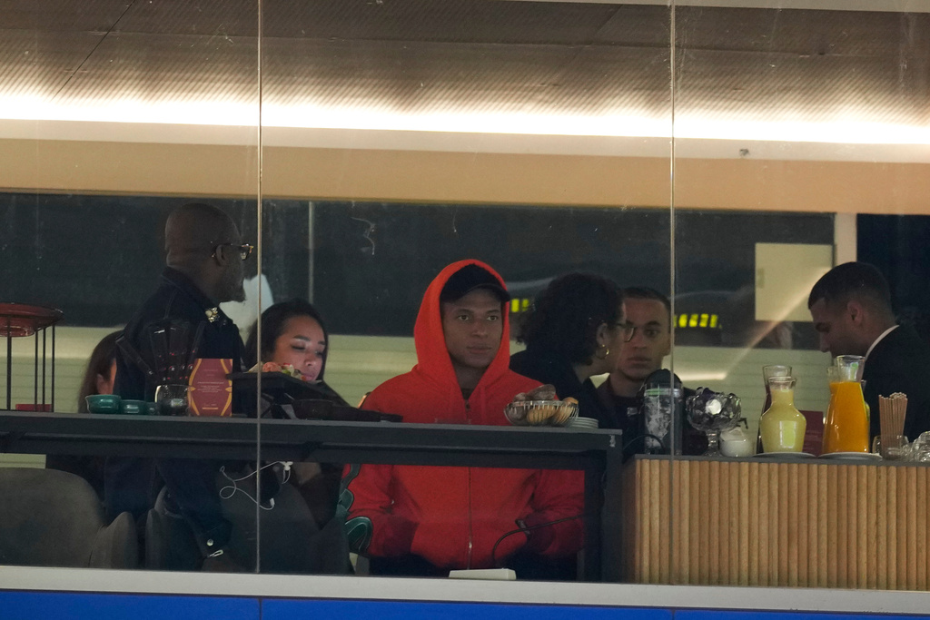France's Kylian Mbappé watches from the stands during the Africa Cup of Nations group F soccer match between Ivory Coast and Cameroon, in Marrakech, Morocco, Sunday, Dec. 28, 2025. (AP Photo/Themba Hadebe)