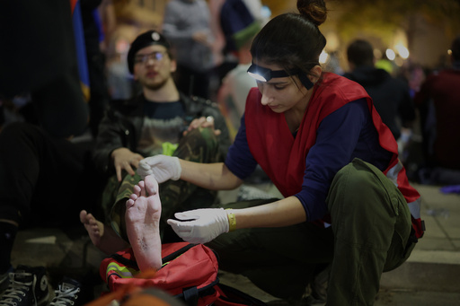 Students rest during a break on a march marking the first anniversary of a train station disaster on Nov. 1, 2024 that killed 16 people in Novi Sad, in Stara Pazova, Serbia, Thursday, Oct. 30, 2025. (AP Photo/Armin Durgut) Students rest during a break on a march marking the first anniversary of a train station disaster on Nov. 1, 2024 that killed 16 people in Novi Sad, in Stara Pazova, Serbia, Thursday, Oct. 30, 2025. (AP Photo/Armin Durgut)