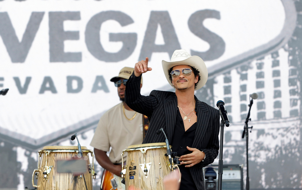 Bruno Mars performs for fans in Toshiba Plaza after a parade down the Las Vegas Strip Friday, April 10, 2026, in Las Vegas, on "Bruno Mars Day." (Steve Marcus/Las Vegas Sun via AP)
