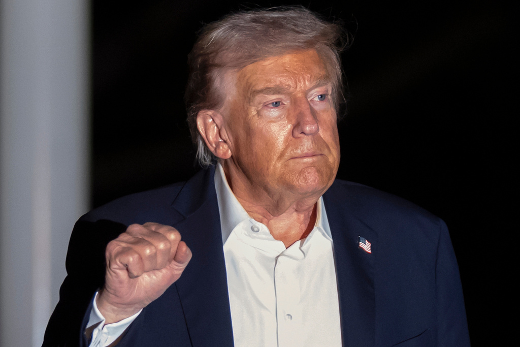President Donald Trump walks across the South Lawn of the White House, early Tuesday, Oct. 14, 2025, in Washington, after returning from a trip to Israel and Egypt. (AP Photo/Mark Schiefelbein)